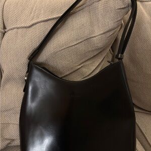 Toscano Sleek Black Leather Shoulder Bag with Crescent Shape